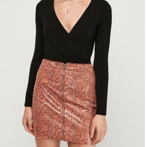 Orange snakeskin mini skirt